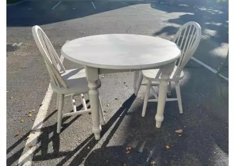 Solid wood round table with 2 chairs.  Painted light gray with chalk paint